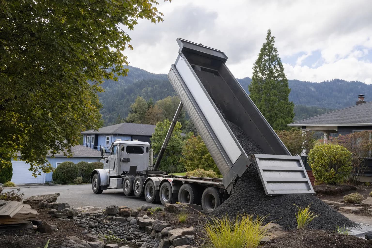 Dump truck delivering gravel